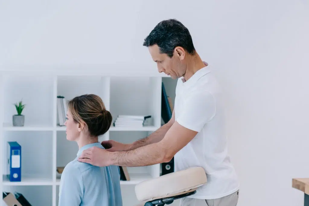 Chiropractor performing spinal adjustment — chiropractic billing services